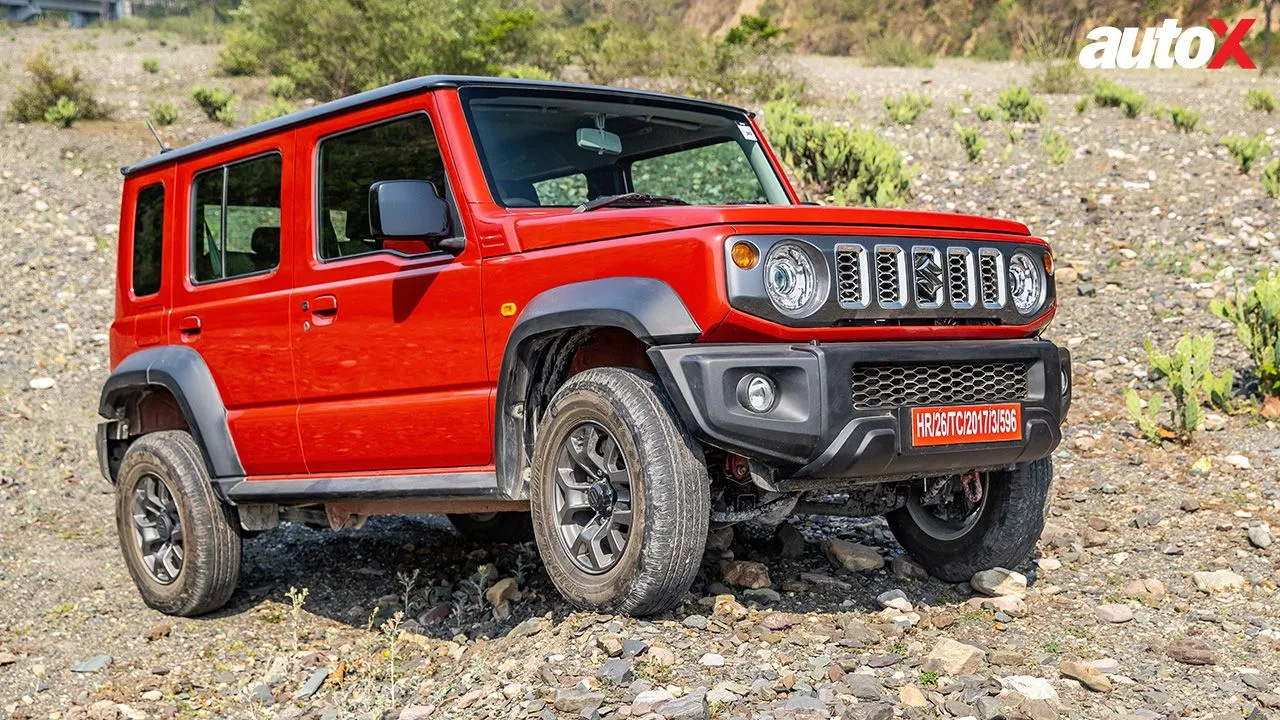 Sizzling Red with Bluish Black Roof Maruti Suzuki Jimny Right side and front view