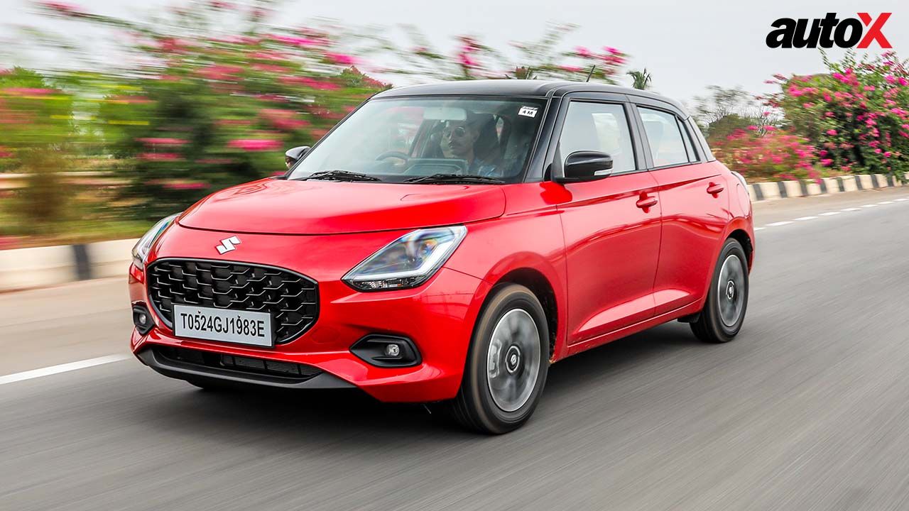 Red Maruti Suzuki Swift Front and Left Side View